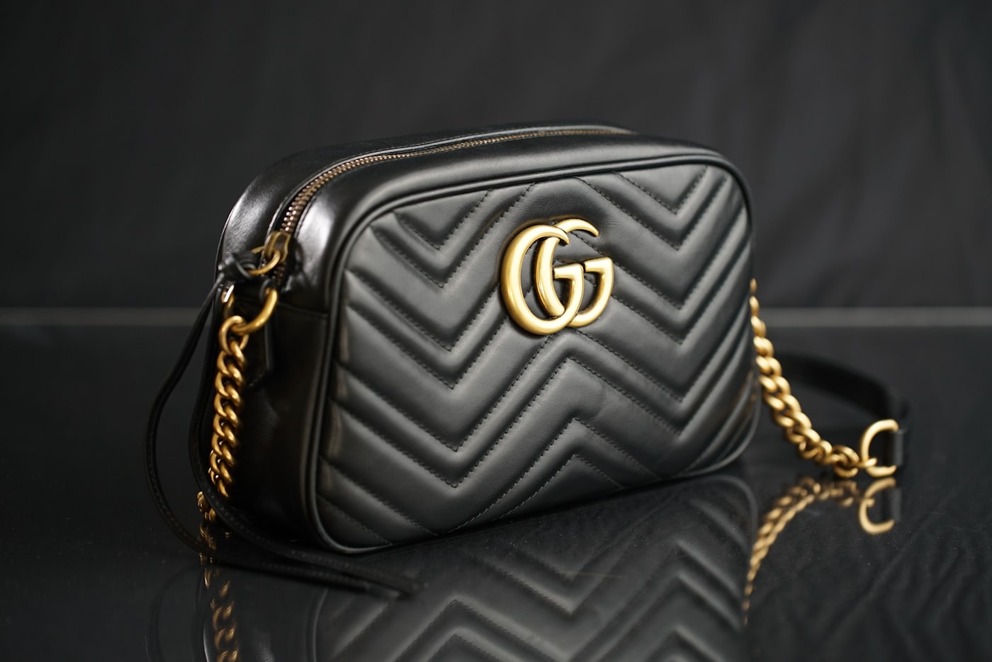 Wall display of structured tooled-leather handbags